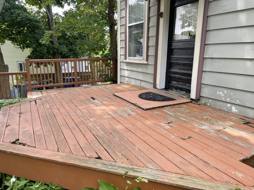 Our new deck repair in Boston project, a wooden deck that is rotting.